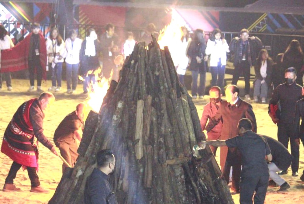 Chief Minister Neiphiu Rio, Chef Gary Mehigan and others lighting the bonfire during the closing ceremony of the 23rd Hornbill Festival at Heritage Village, Kisama, on December 10. (Morung Photo)